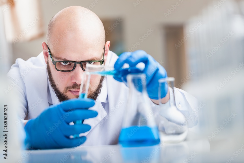 Man researcher carrying out scientific research. Man researcher carrying out scientific research.