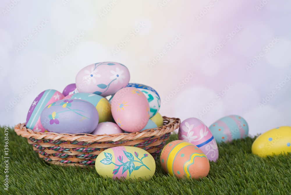 Colorful Easter Eggs and Basket Against a Multicolored Background