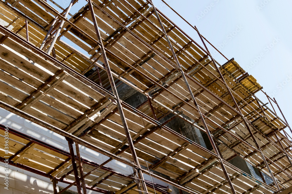 Metal scaffolding with wooden beams