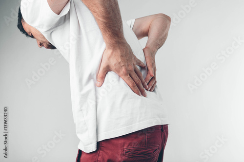Obraz na plátně A man holding his penis with on the white background