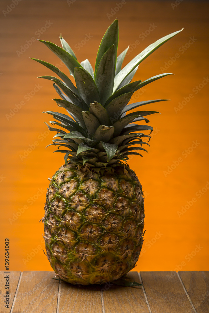 Delicious pineapple on wooden board