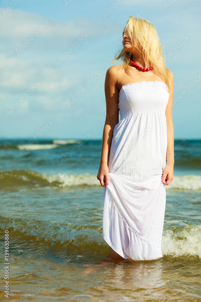 Young woman chilling out on the beach. Young woman chilling out on the beach.