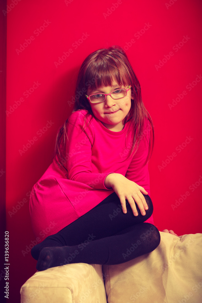 Little toddler girl sitting on sofa Little toddler girl sitting on sofa