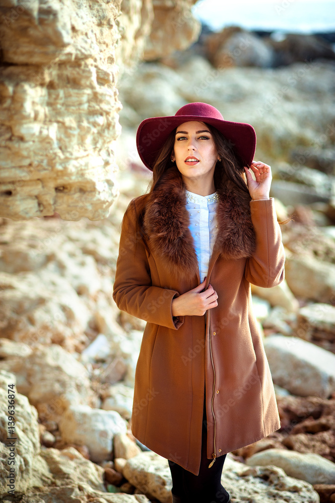 Obraz premium Portrait of the beautiful fashionable girl in a hat outdoor on sunny spring day.