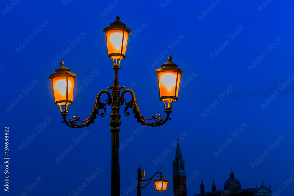 old street lamp at night in Venice, Italy