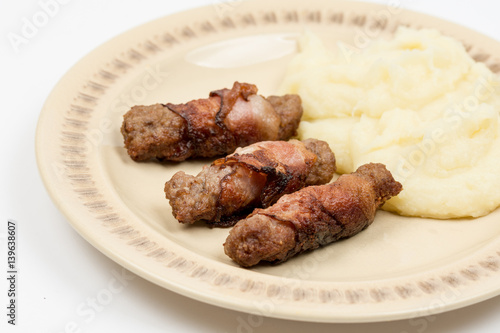Grilled kebabs in bacon with mashed potatoes