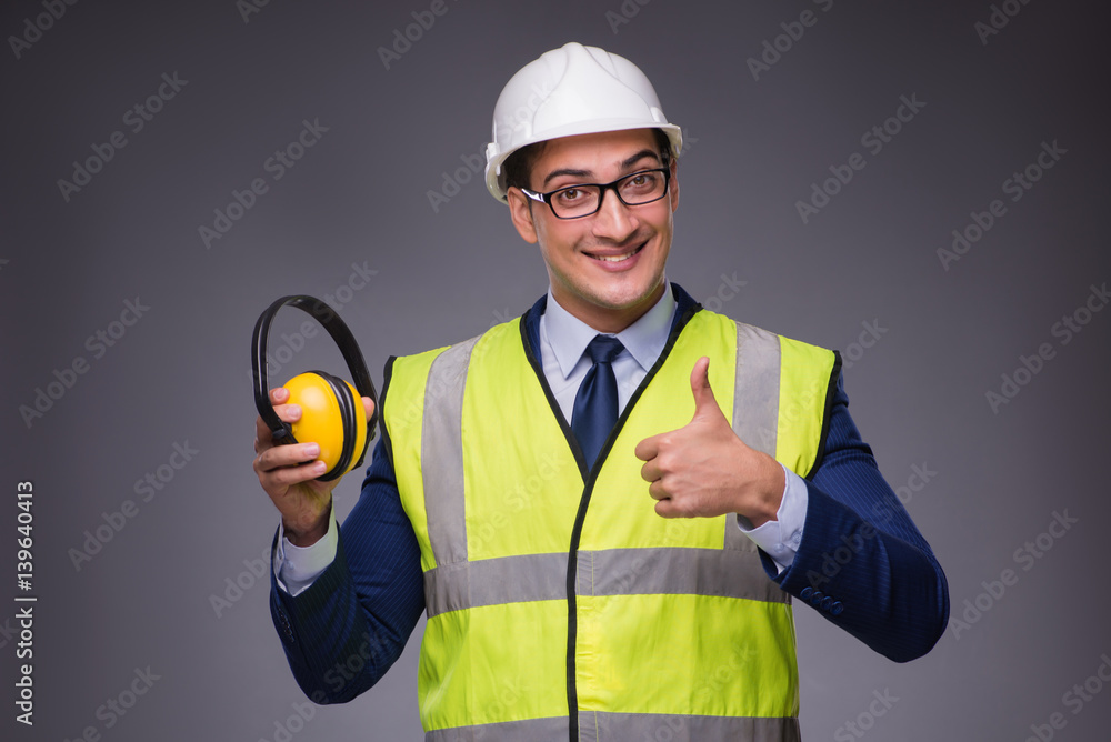 Man wearing hard hat and construction vest Man wearing hard hat and construction vest