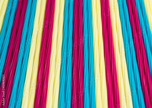 Texture of colorful straight lines by plastic tubes.