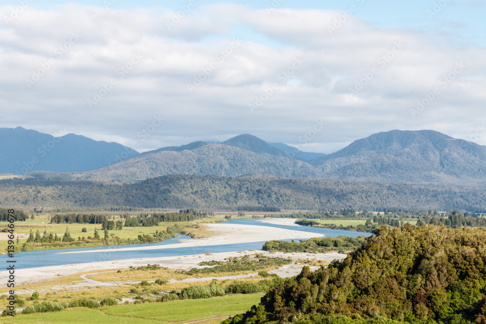 aerial view of Hokitika river and Southern Alps in New Zealand