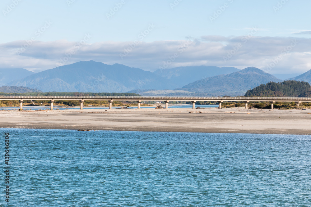 bridge crossing Hokitika river on West Coast of New Zealand