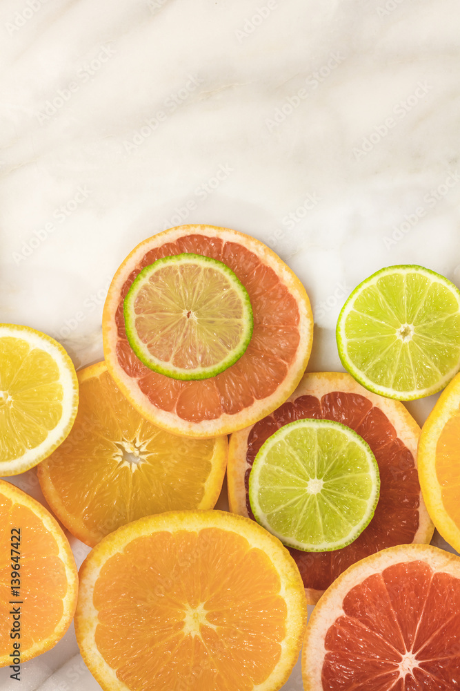 Grapefruit, lime, lemon, and orange slices with copyspace Grapefruit, lime, lemon, and orange slices with copyspace