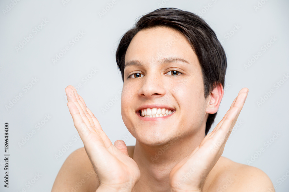 young man who are pleased with their skin becoming clean, men's skincare concept young man who are pleased with their skin becoming clean, men's skincare concept