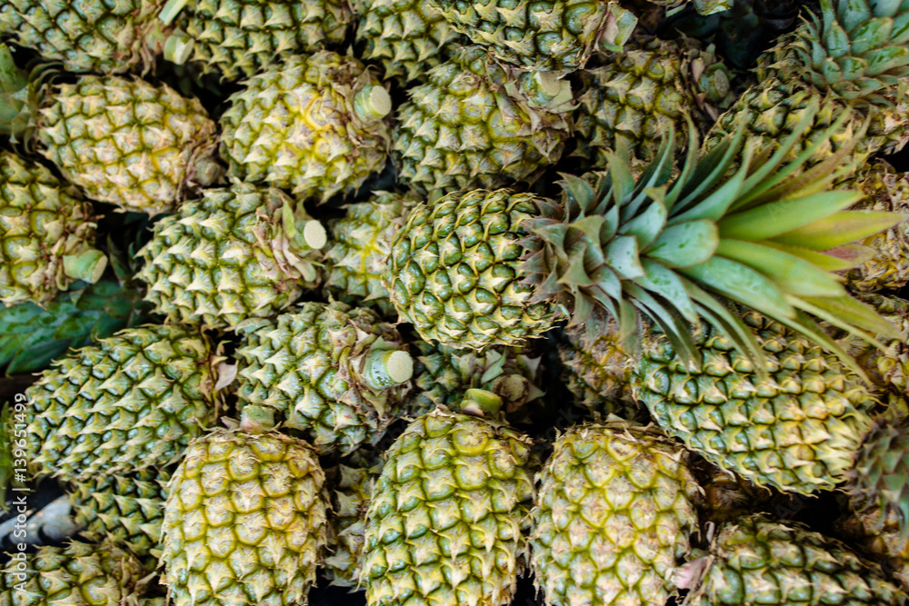 sweet Thai pineapples lie on a counter sweet Thai pineapples lie on a counter
