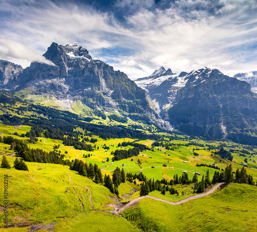Colorful morning view of Grindelwald village valley from cableway. © Andrew Mayovskyy