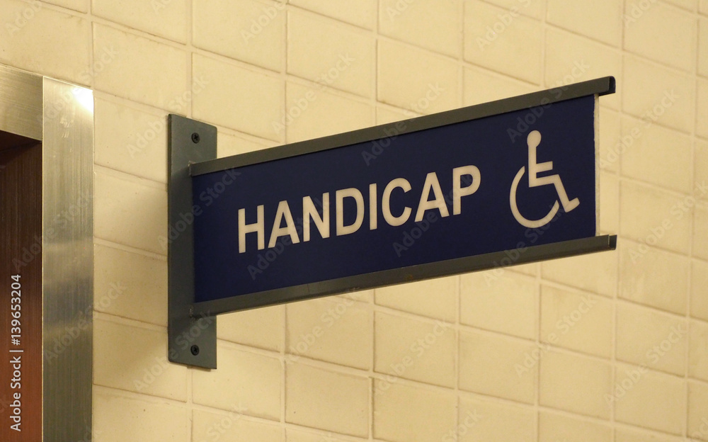 Toilet sign plastic tab with white and blue color . Toilet sign plastic tab with white and blue color .