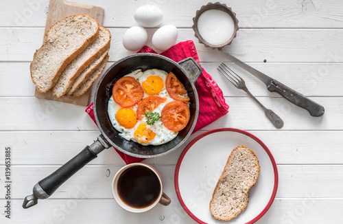 eggs overeasy in a frying pan, topview photo