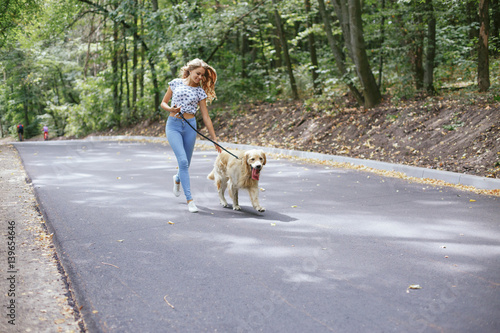 couple walking outdoors with her dog
