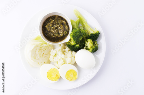 Top views of thai sauce with boiled vegetables and eggs for Thai foods concept