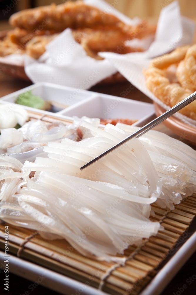sliced raw squid sliced raw squid