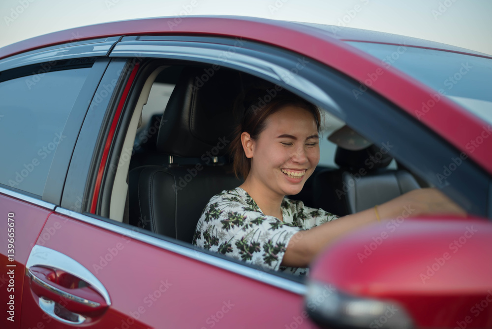 young woman happy in car