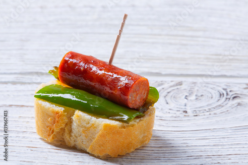 pinchos pintxos chistorra with pepper tapas photo