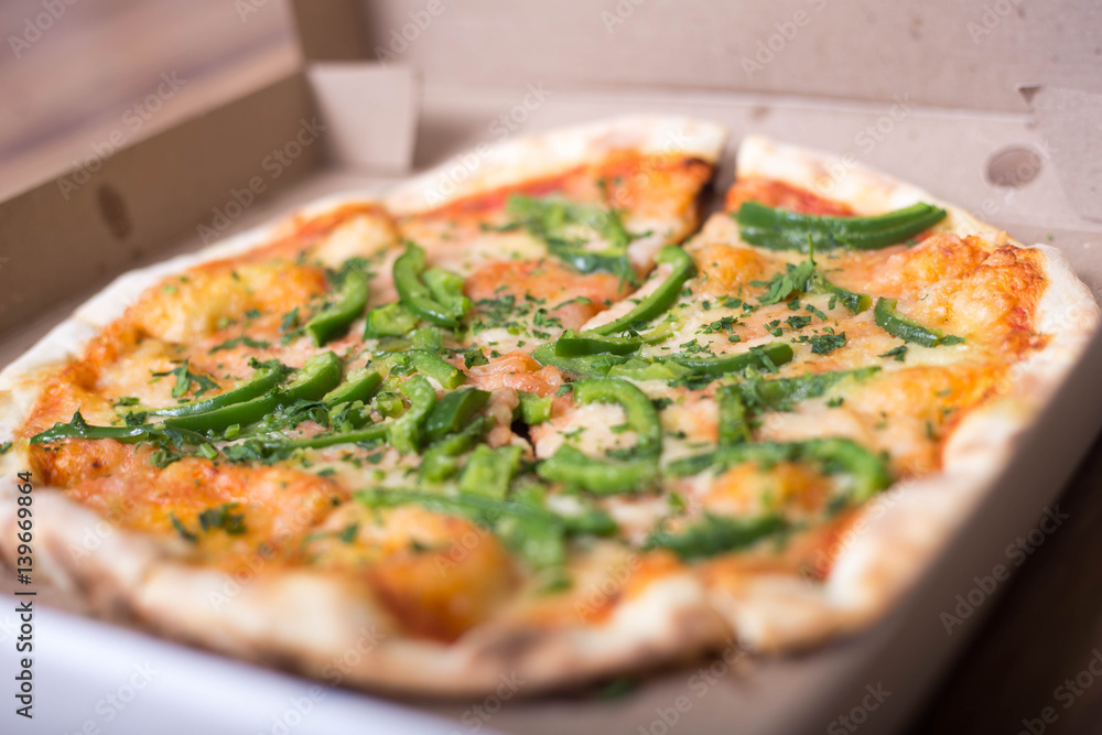 Italian pizza with green pepper in paper box tasty macro picture useful for background Italian pizza with green pepper in paper box tasty macro picture useful for background