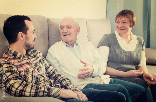 Grandparents and grandson talk © JackF