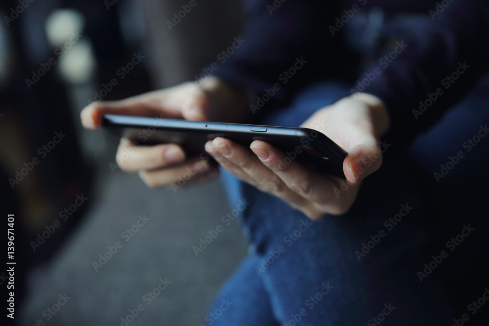 Asian female with hands typing text message Asian female with hands typing text message
