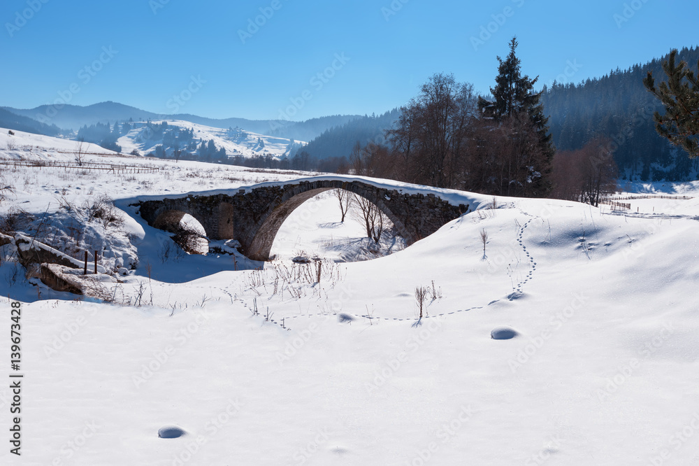 Old Roman bridge covered from the snow in Bulgaria Old Roman bridge covered from the snow in Bulgaria