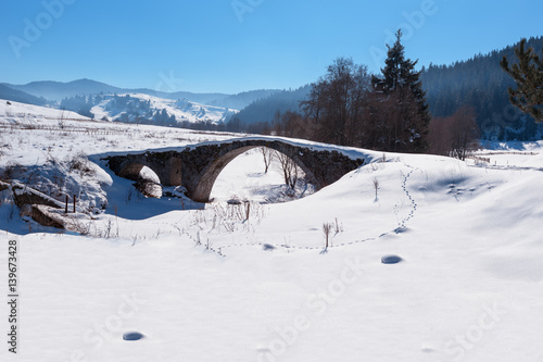 Old Roman bridge covered from the snow in Bulgaria