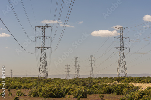 Electricity supply towers and structures transmit power along high voltage wires and cables