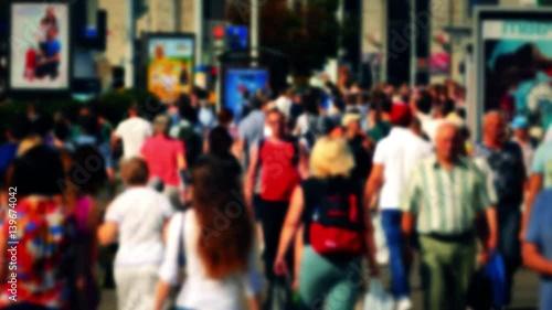 Wallpaper Mural Crowd of People / Commuters Walking / Busy Street. Anonymous crowd on a busy street. 2x slow motion of people walk down a busy street with advertising, billboards, cars and public transport. Torontodigital.ca