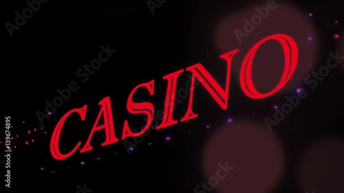 Red casino sign with flashing lights at entrance to casino glows in the dark.