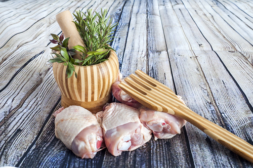 herbs and thighs Raw chicken