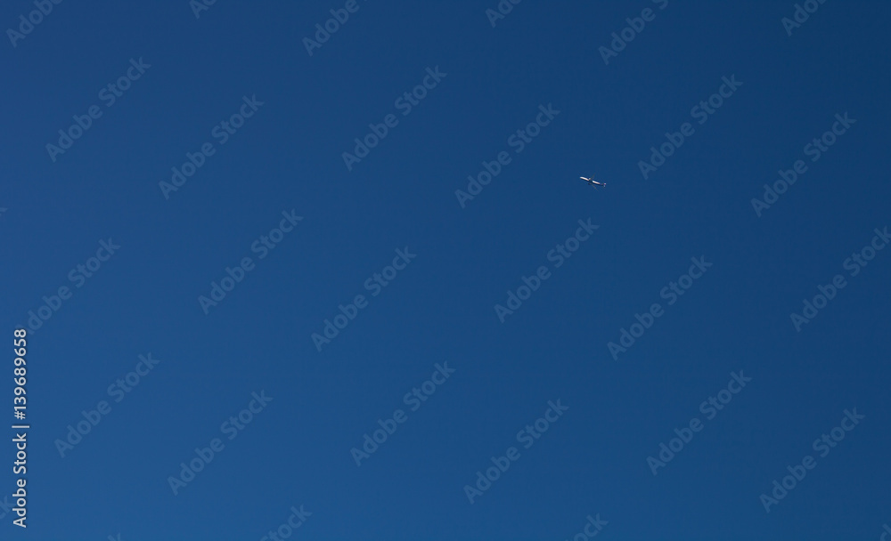 Airplane on a blue sky. Selective focus Airplane on a blue sky. Selective focus