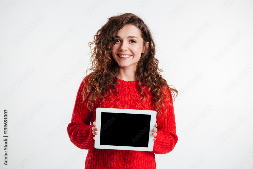 Beautiful young woman showing tablet computer with blank screen Beautiful young woman showing tablet computer with blank screen