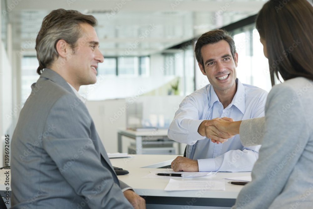 Businessman shaking hands with client Businessman shaking hands with client