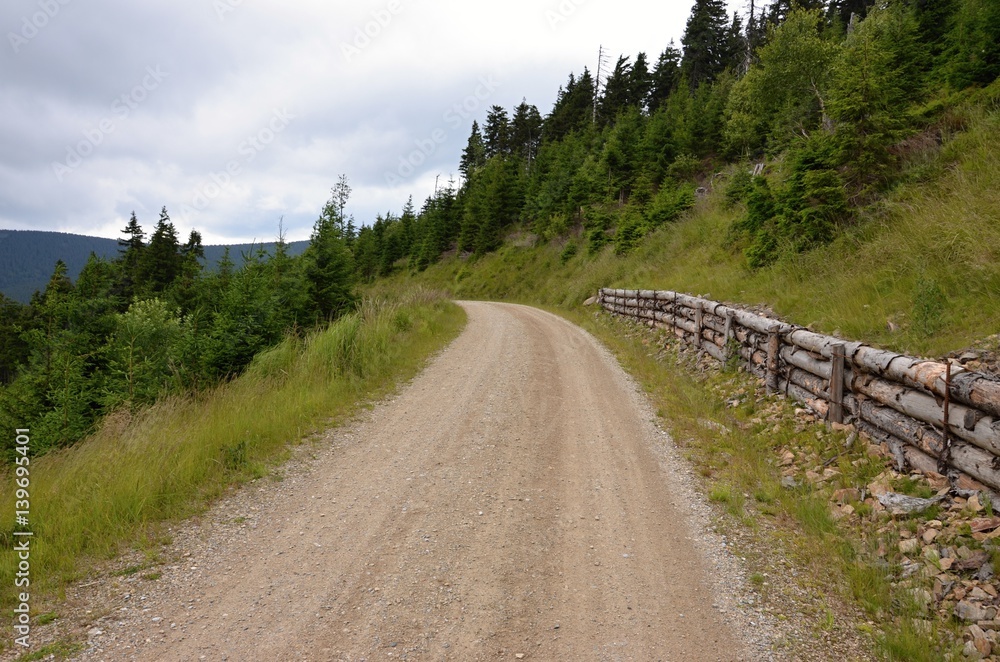 Mountain gravel road in a beautiful nature