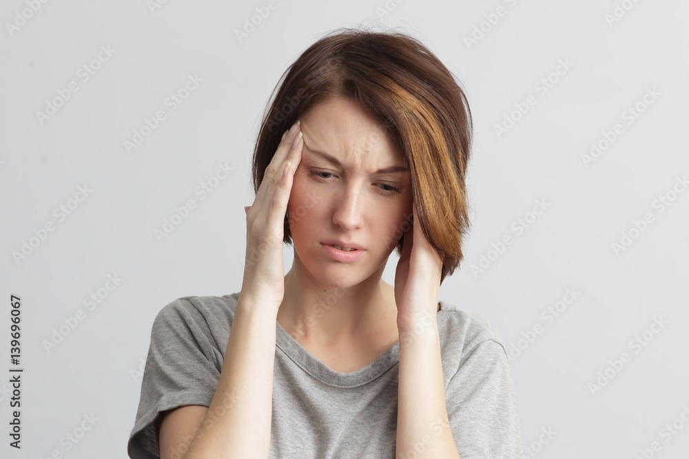 girl suffers from terrible headaches and compresses the head with fingers. Forget and remember something, suffer from illness girl suffers from terrible headaches and compresses the head with fingers. Forget and remember something, suffer from illness