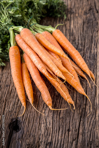 Carrot. Fresh Carrots bunch. Baby carrots. Raw fresh organic orange carrots. Healthy vegan vegetable food.