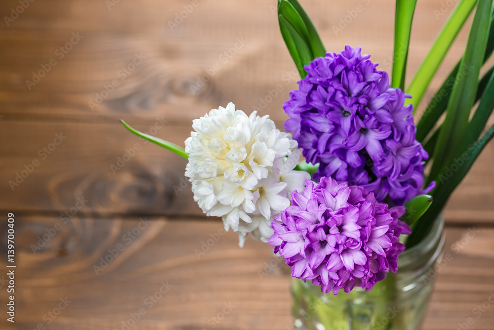 Fresh hyacinth flowers on wooden background. Beautiful idea for greeting cards for Valentine's day, March 8 and mother's day. Free space Fresh hyacinth flowers on wooden background. Beautiful idea for greeting cards for Valentine's day, March 8 and mother's day. Free space