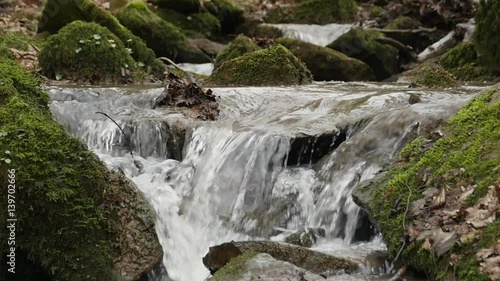 slow motion shot of a river flow / waterfall photo