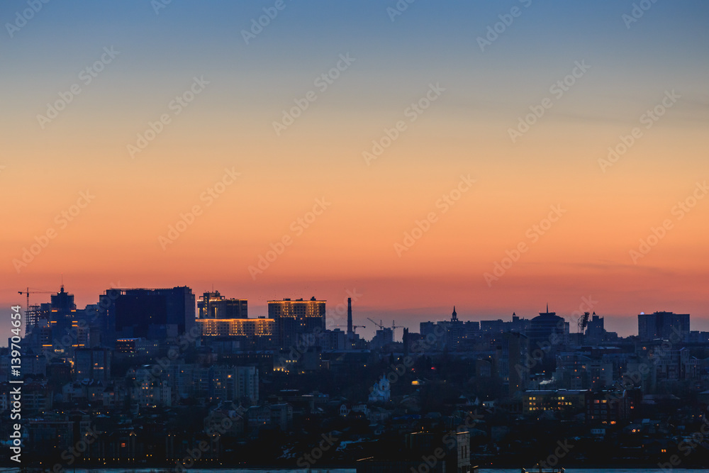 Night Voronezh city after sunset, blue hour, night lights of houses, buildings