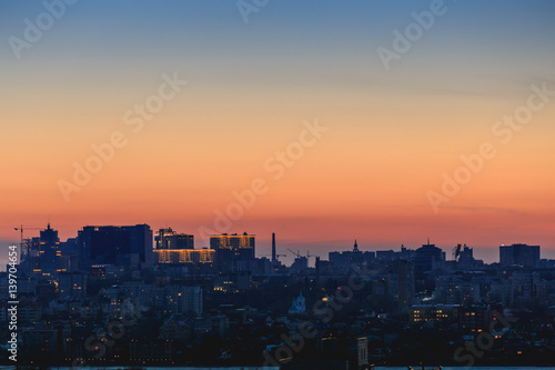 Night Voronezh city after sunset, blue hour, night lights of houses, buildings © DedMityay