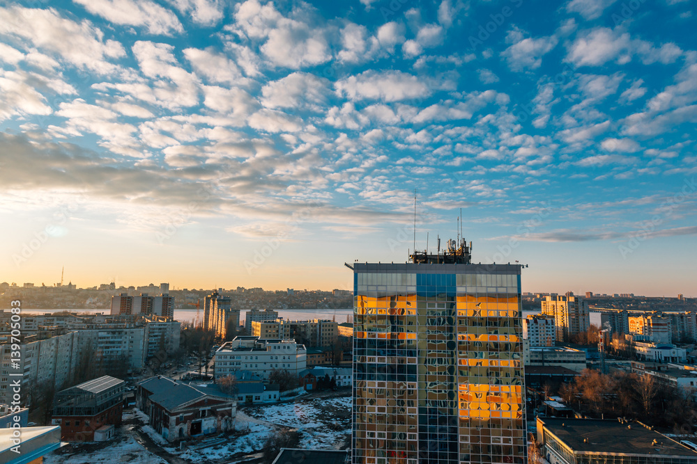 Urban cityscape at sunset, Voronezh city, panorama with city line, clouds