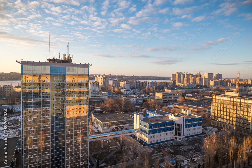 Urban cityscape at sunset, Voronezh city, panorama with city line, clouds 