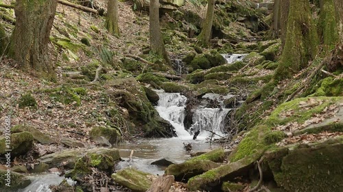 slow motion shot of a river flow / waterfall