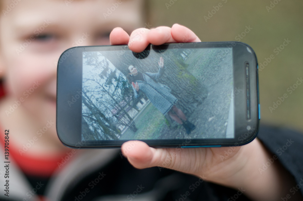 Little boy taking photos