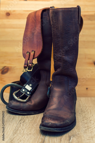 shoes with leather belt in wooden background
