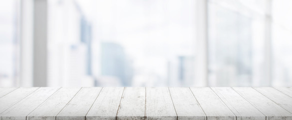 Wood table top and blur glass window wall building banner background with vintage filter - can used for display or montage your products.